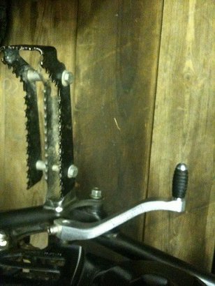 Aluminum gear kicker and make shift pegs